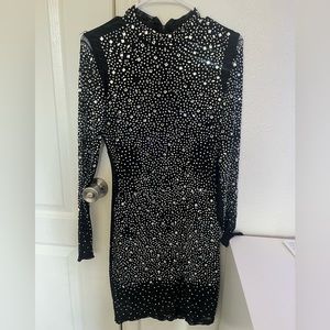 Windsor Dress. Black with blinged studs. Never worn. Alittle torn on the shoulde